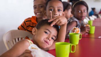 kids eating at ramacrisna institute. Meals donation is a strategy to combat hunger in Brazil